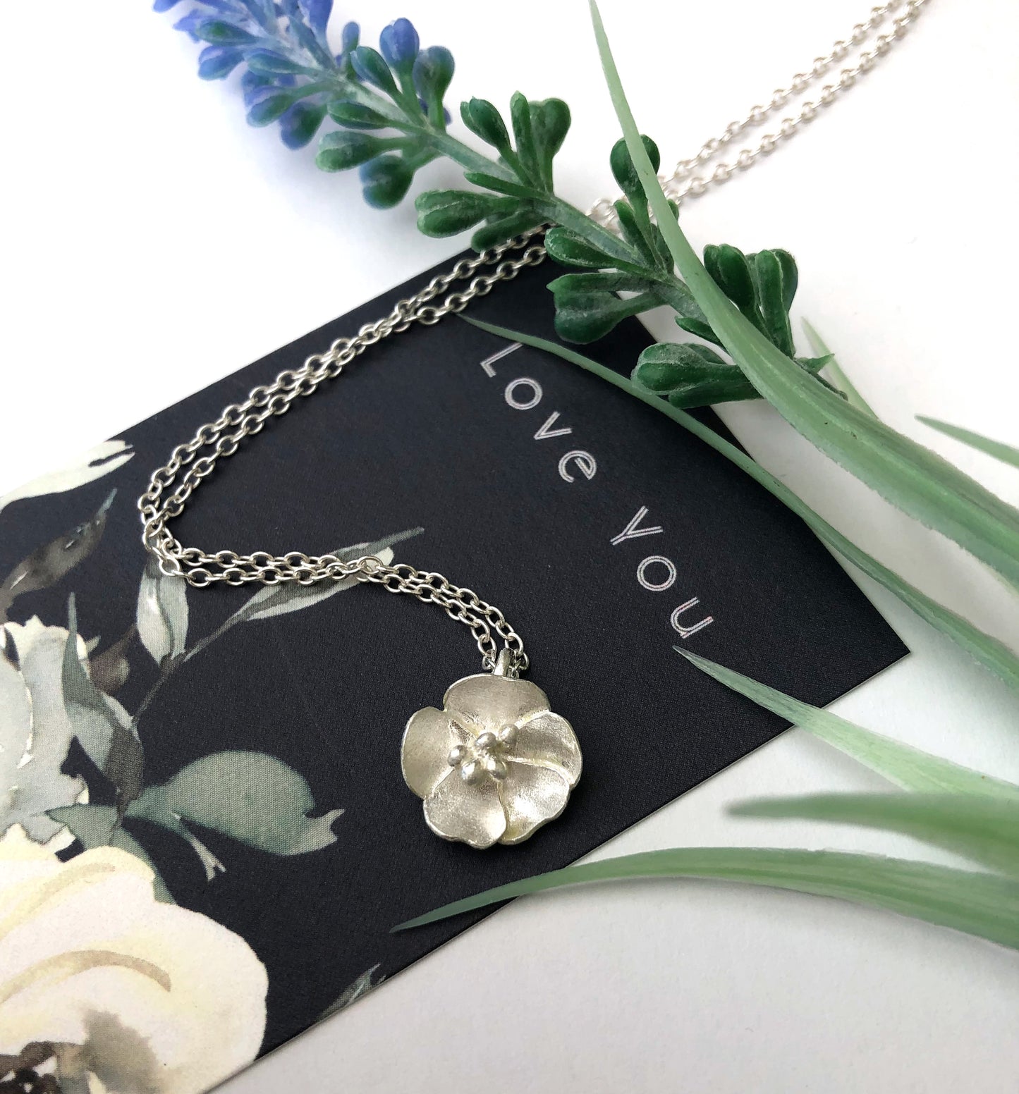 sterling silver buttercup necklace on love you gift card
