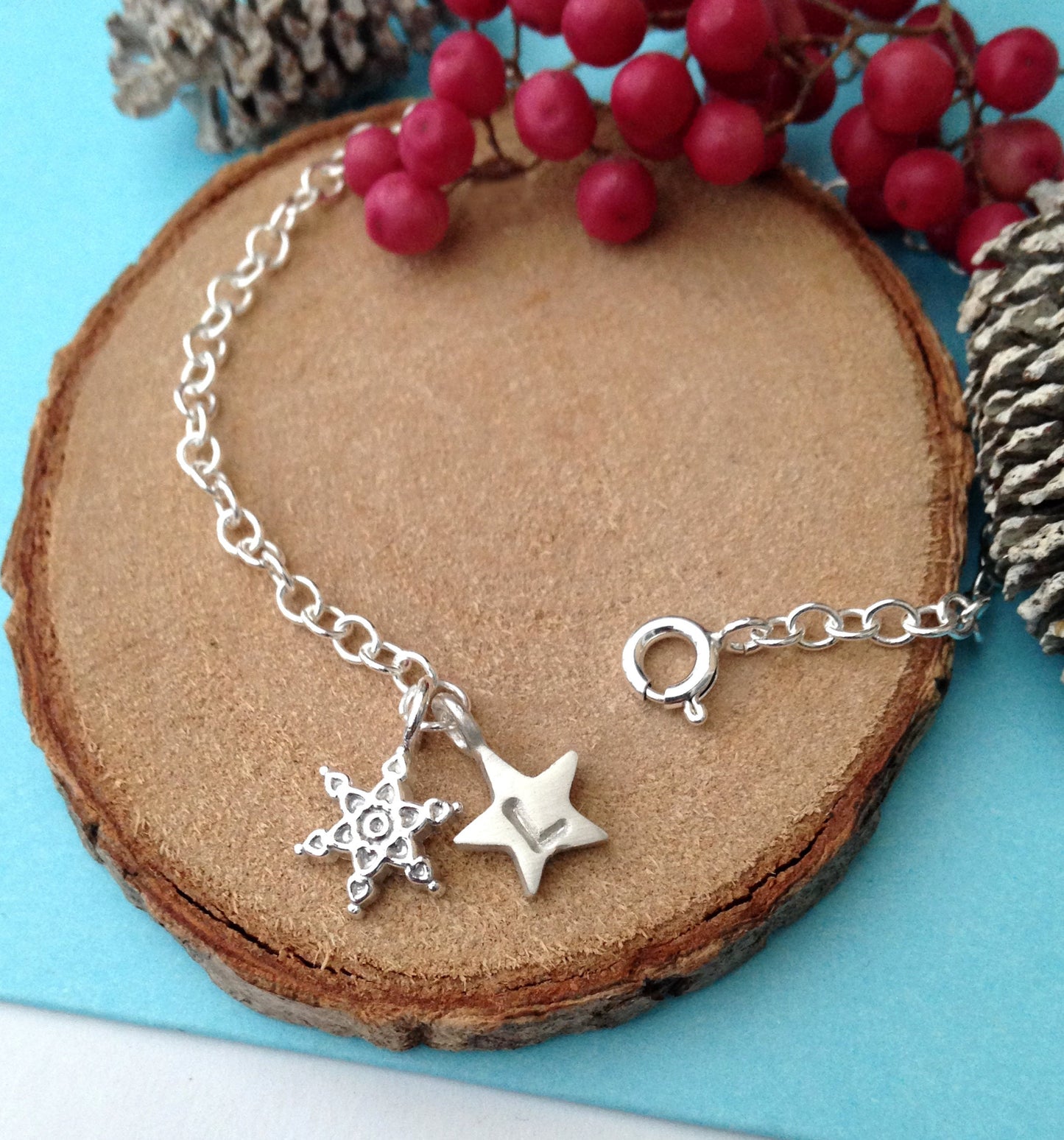 Personalised Sterling Silver Snowflake Bracelet With Initial Star Charm