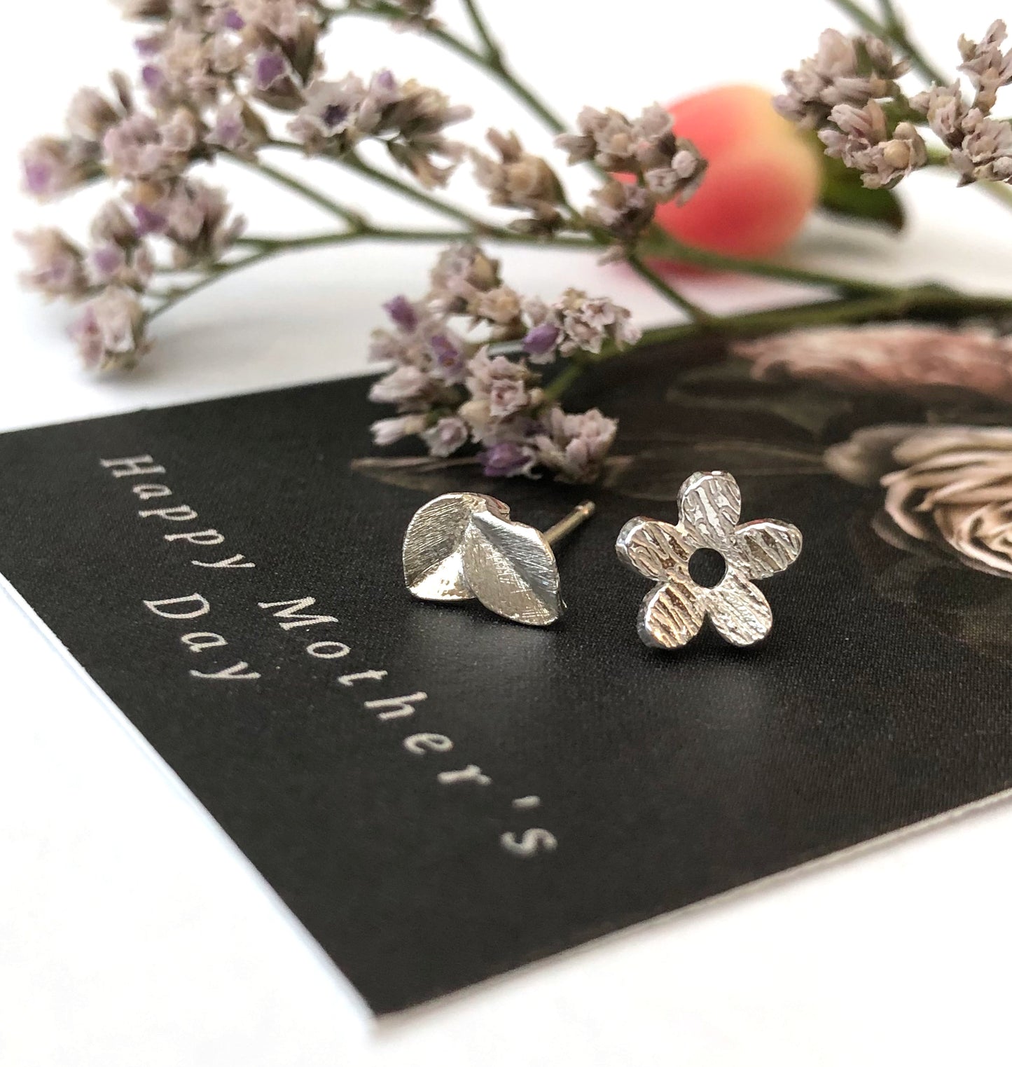 sterling silver mismatched flower and leaf earrings on happy mothers day card