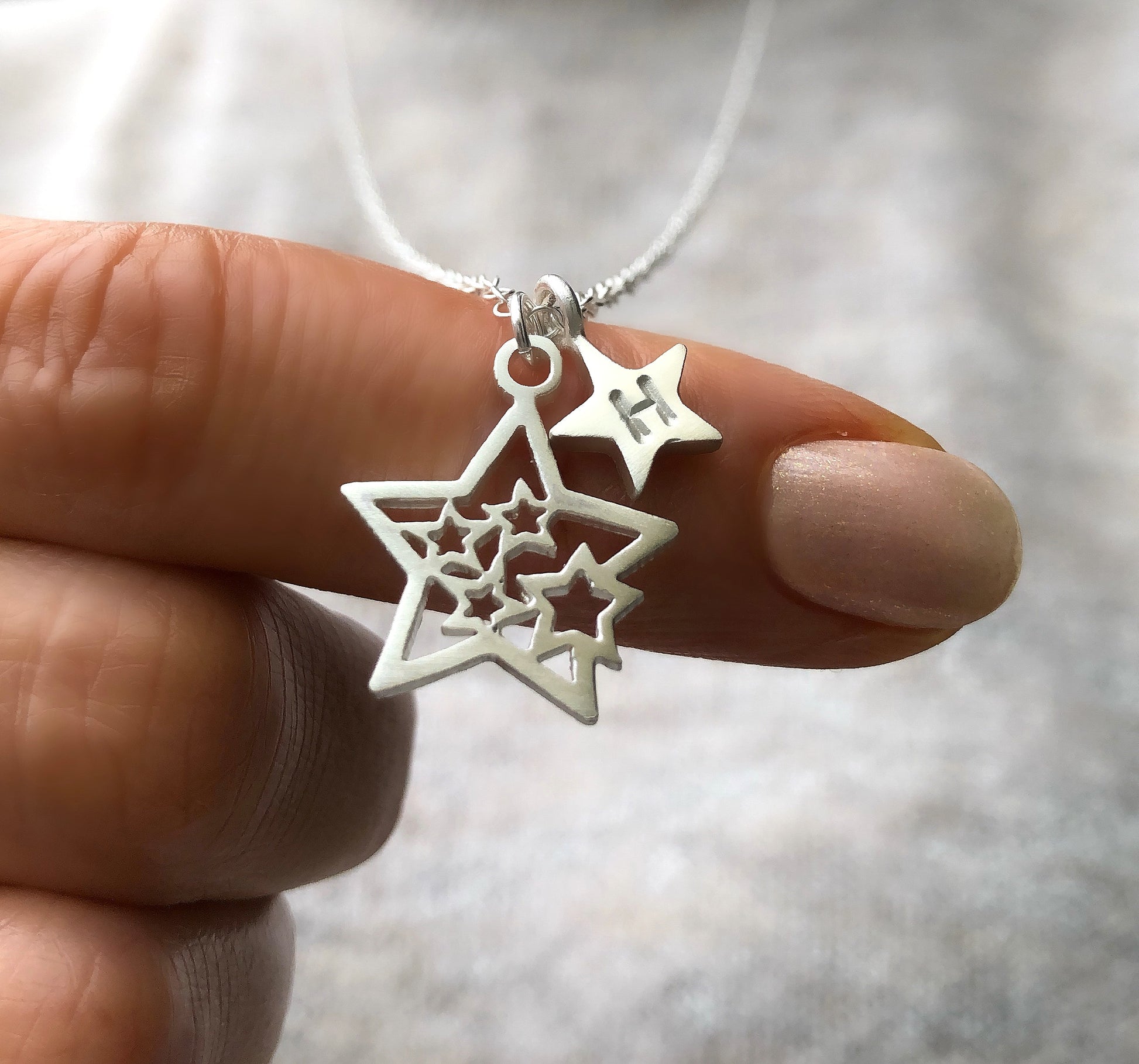 cluster star and initial star charm necklace 
